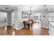 Inviting dining room boasts wood floors, chandelier, and ample natural light at 304 34Th W St, Bradenton, FL 34205