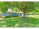Inviting single-story home with mature trees, and beautifully landscaped front yard at 304 34Th W St, Bradenton, FL 34205
