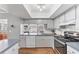 Well-lit kitchen with updated appliances and ample countertop space for cooking and prep at 304 34Th W St, Bradenton, FL 34205