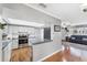 Modern kitchen with stainless steel appliances and open layout into the living room at 304 34Th W St, Bradenton, FL 34205