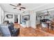 Living room with terra cotta tile floor and view of the kitchen and dining room at 304 34Th W St, Bradenton, FL 34205