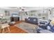 Bright living room with hardwood floors, ample seating, and large windows at 304 34Th W St, Bradenton, FL 34205