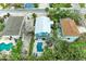Aerial view of a charming coastal home with a private pool, surrounded by lush tropical landscaping and neighborhood charm at 315 Magnolia Ave, Anna Maria, FL 34216