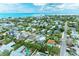 Stunning aerial view of a coastal community with colorful homes and lush tropical landscaping near the ocean at 315 Magnolia Ave, Anna Maria, FL 34216