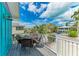 Outdoor seating on the balcony with lovely neighborhood views at 315 Magnolia Ave, Anna Maria, FL 34216