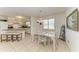 Cozy dining area connected to the kitchen and featuring stylish decor and ample seating at 315 Magnolia Ave, Anna Maria, FL 34216
