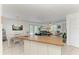 Open-concept living area and dining space, enhanced by a view of the backyard and an open floor plan at 315 Magnolia Ave, Anna Maria, FL 34216