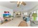 Bright living room with open concept to the kitchen and dining area and coastal decor at 315 Magnolia Ave, Anna Maria, FL 34216