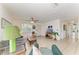 Relaxing living room with tile floors, comfortable seating, and a TV for entertainment at 315 Magnolia Ave, Anna Maria, FL 34216