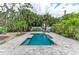 Beautiful backyard pool and patio area, perfect for relaxing and entertaining in a tropical paradise at 315 Magnolia Ave, Anna Maria, FL 34216