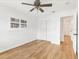 Bedroom boasts hardwood floors, ceiling fan, closet, and natural light at 3328 Kingswood Dr, Sarasota, FL 34232