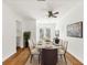 Light dining room with table set for six people and a decorative plant in the corner at 3328 Kingswood Dr, Sarasota, FL 34232