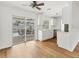 Modern kitchen featuring white cabinetry, stainless steel appliances, and a view of the pool at 3328 Kingswood Dr, Sarasota, FL 34232