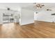 Open-concept living area flowing into the kitchen with sliding doors to the pool area at 3328 Kingswood Dr, Sarasota, FL 34232
