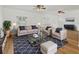 Bright living room showcasing stylish furniture, hardwood floors, and plantation shutters at 3328 Kingswood Dr, Sarasota, FL 34232
