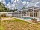 This property includes a large screened-in pool area with a fire pit and outdoor seating at 3328 Kingswood Dr, Sarasota, FL 34232