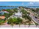 Stunning aerial view of a waterfront property showcasing lush landscaping and neighborhood charm at 335 Arthur Dr, Sarasota, FL 34236