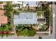 Overhead aerial shot of home showcasing modern architecture with a backyard pool and lush, private landscaping at 335 Arthur Dr, Sarasota, FL 34236
