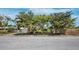 Charming single-story home with a well-maintained lawn, mature trees, and a driveway at 335 Arthur Dr, Sarasota, FL 34236