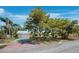 Charming single-story home with a well-maintained lawn, mature trees, and a driveway at 335 Arthur Dr, Sarasota, FL 34236