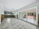Spacious living room featuring tile floors and sliding glass doors at 335 Arthur Dr, Sarasota, FL 34236