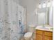 Bathroom featuring a shower with curtain, vanity, and marine life decor at 3402 Parkridge Cir, Sarasota, FL 34243