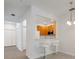 Bright kitchen with bar seating, stainless steel microwave, and wood cabinetry at 3402 Parkridge Cir, Sarasota, FL 34243