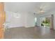 An open floor plan featuring wood floors and sliding glass doors to the patio at 3402 Parkridge Cir, Sarasota, FL 34243