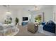 Bright living room featuring modern furniture and a sliding glass door to patio at 3402 Parkridge Cir, Sarasota, FL 34243