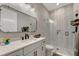 Stylish bathroom with rainfall showerhead and a spacious quartz countertop vanity and modern fixtures at 3574 Recurve Cir, Sarasota, FL 34240