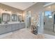 Modern bathroom with a double vanity, a large shower, and decorative accents at 3574 Recurve Cir, Sarasota, FL 34240