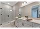Modern bathroom features dual shower heads and quartz countertop and a large mirror at 3574 Recurve Cir, Sarasota, FL 34240