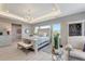Bright bedroom showcasing a decorative ceiling, neutral color palette, and stylish furniture at 3574 Recurve Cir, Sarasota, FL 34240