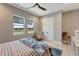 Well-lit bedroom with windows, ample closet space, and neutral decor at 3574 Recurve Cir, Sarasota, FL 34240
