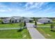Stunning white home with lush green lawn, white picket fence, and a long driveway at 3574 Recurve Cir, Sarasota, FL 34240