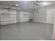Spacious three-car garage with epoxy flooring and three garage door openers at 3574 Recurve Cir, Sarasota, FL 34240