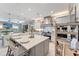 Expansive kitchen with a central island, stainless steel appliances, and ample storage, offering a modern and functional design at 3574 Recurve Cir, Sarasota, FL 34240