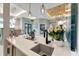 Bright kitchen features a large island, pendant lighting, and modern fixtures, with open access to other living spaces at 3574 Recurve Cir, Sarasota, FL 34240