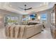 This living room has a plush sofa, modern fireplace, and access to the lanai at 3574 Recurve Cir, Sarasota, FL 34240
