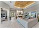 Spacious living room featuring a wooden ceiling, fireplace and a sliding glass door at 3574 Recurve Cir, Sarasota, FL 34240