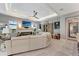 A cozy living room features a modern fireplace, tv, plush sofa, and elegant decor at 3574 Recurve Cir, Sarasota, FL 34240