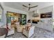 Comfortable patio area featuring outdoor seating, a built in grill, and a ceiling fan for comfortable outdoor living at 3574 Recurve Cir, Sarasota, FL 34240