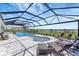 Beautiful screened-in pool with spa, fountains, and plenty of lounge space at 3574 Recurve Cir, Sarasota, FL 34240