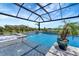 Inviting screened pool with water features and jacuzzi, perfect for relaxation and outdoor entertainment at 3574 Recurve Cir, Sarasota, FL 34240