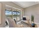 Sitting area with sliding glass doors leading to the screened-in pool and lanai area at 3574 Recurve Cir, Sarasota, FL 34240