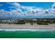 Breathtaking aerial view of the ocean, beach, and community highlighting the coastal lifestyle at 3630 Gulf Of Mexico Dr # 202, Longboat Key, FL 34228