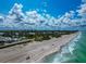 Aerial shot of community close to the beach showcasing the proximity to the ocean and coastal living at 3630 Gulf Of Mexico Dr # 202, Longboat Key, FL 34228