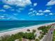 Stunning coastal view featuring the beach, ocean, and nearby road, illustrating the ease of access and natural beauty at 3630 Gulf Of Mexico Dr # 202, Longboat Key, FL 34228