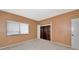 Bedroom with tan wallpaper, carpet flooring and a double window for natural light at 3630 Gulf Of Mexico Dr # 202, Longboat Key, FL 34228