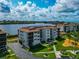 Waterfront condos feature balconies with lush landscaping and a tranquil water view at 3630 Gulf Of Mexico Dr # 202, Longboat Key, FL 34228